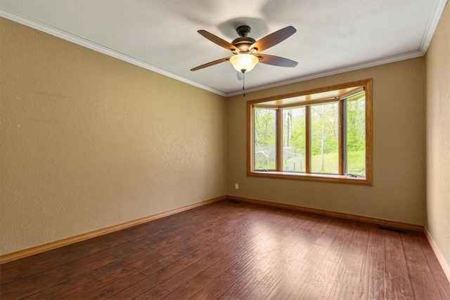 5 Sorbie Dr, Bella Vista, AR 72715 - spare room featuring dark wood-style flooring, crown molding, a ceiling fan, and a textured wall