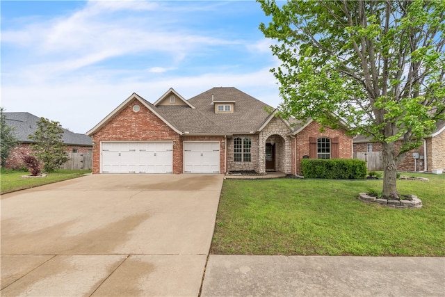 view of front of home with concrete driveway, brick siding, an attached garage, and a front lawn
