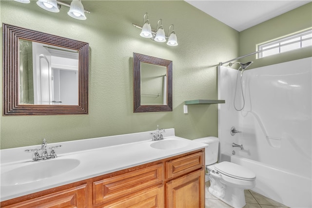 full bath with double vanity, toilet, a sink, and tile patterned flooring