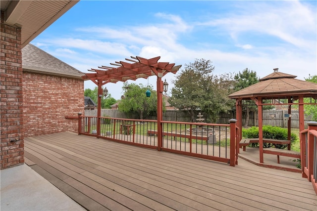 deck featuring a gazebo, a fenced backyard, and a pergola