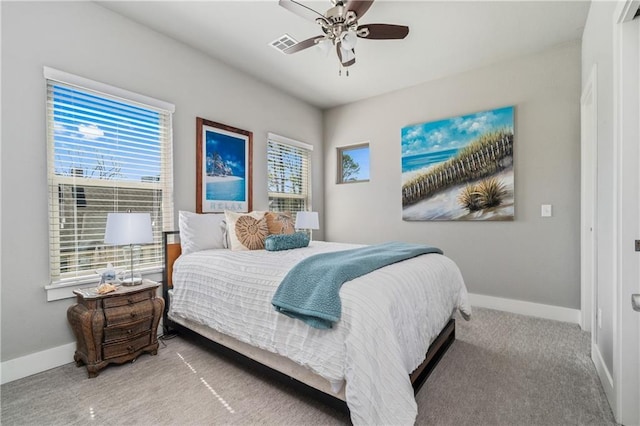 113 SE F St, Bentonville, AR 72712 - carpeted bedroom with baseboards, a ceiling fan, visible vents, and multiple windows