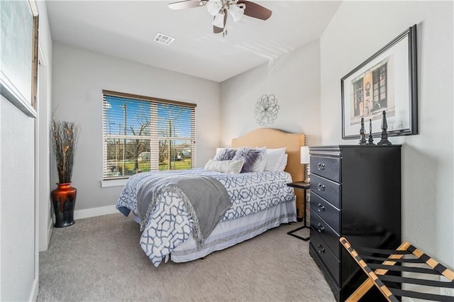113 SE F St, Bentonville, AR 72712 - bedroom featuring baseboards, ceiling fan, light carpet, and visible vents