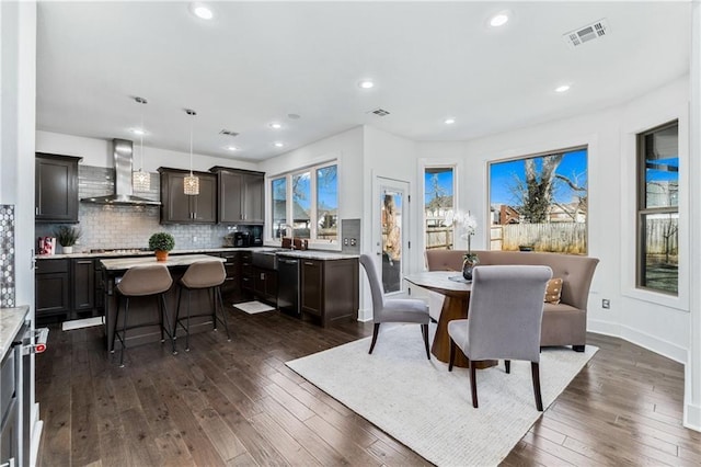 113 SE F St, Bentonville, AR 72712 - dining area with recessed lighting, dark wood finished floors, and visible vents