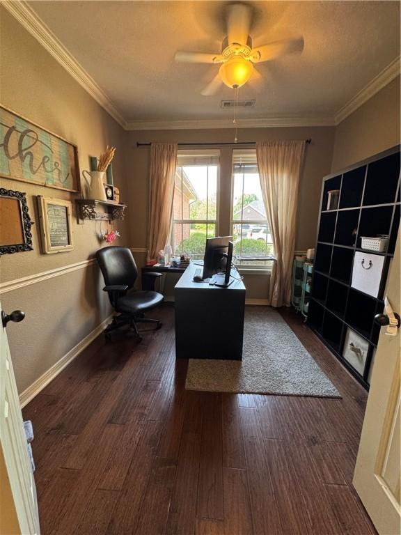 home office with crown molding, ceiling fan, wood finished floors, and visible vents