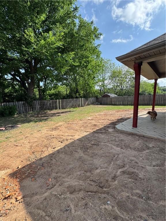 view of yard with a fenced backyard and a patio area