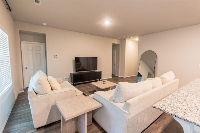 3715 S 1st Pl, Rogers, AR 72758 - living room with baseboards, dark wood-style flooring, and visible vents