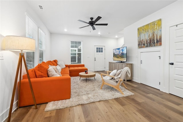 living room featuring ceiling fan, recessed lighting, wood finished floors, and visible vents