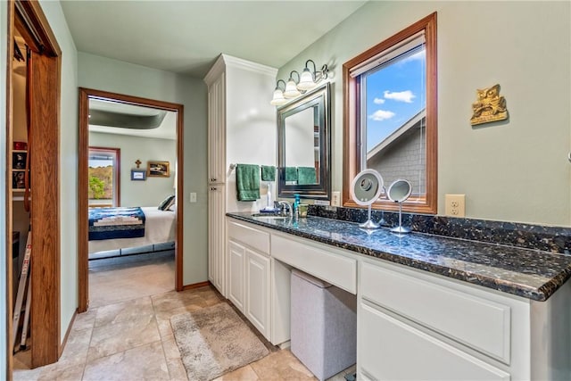 ensuite bathroom featuring ensuite bathroom and vanity