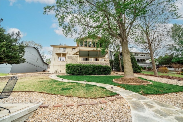 50 Churchill Dr, Bella Vista, AR 72715 - rear view of house with a yard and stairs