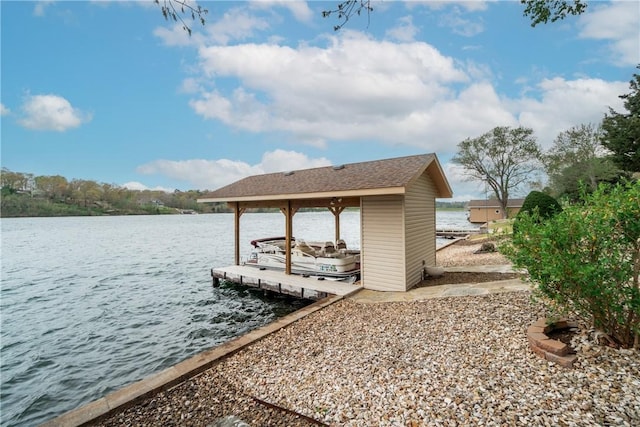dock area with a water view and boat lift