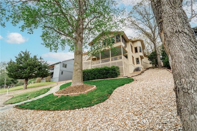 view of front of house with stucco siding and a front lawn