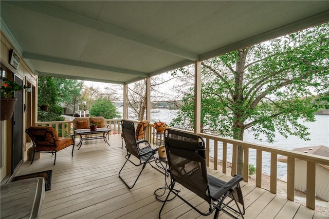 wooden terrace with a water view
