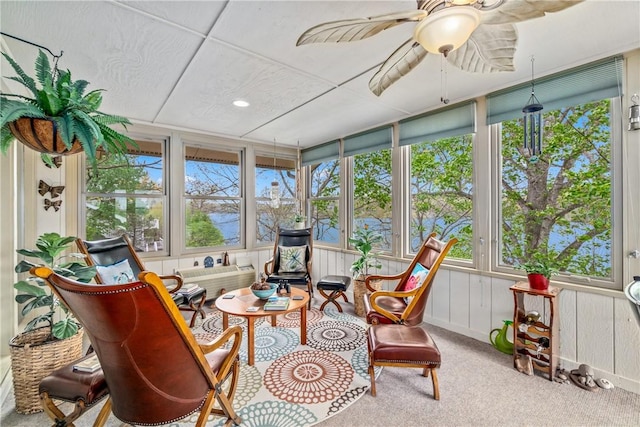sunroom with carpet and recessed lighting