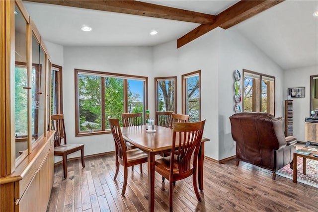 dining space with wood-type flooring, lofted ceiling with beams, baseboards, and recessed lighting