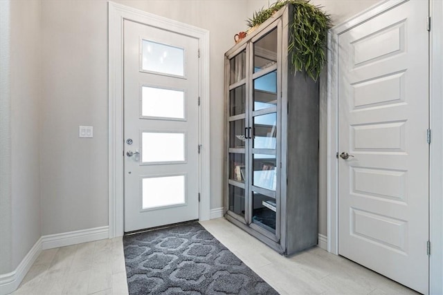 foyer entrance with baseboards