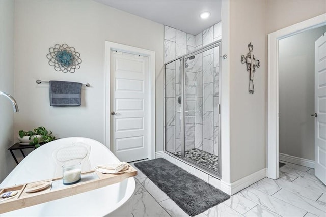 full bath featuring a stall shower, baseboards, marble finish floor, a soaking tub, and recessed lighting