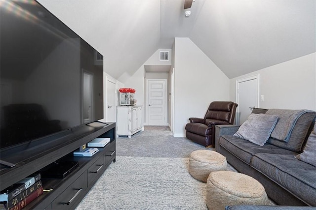 living room with carpet flooring, baseboards, visible vents, and lofted ceiling