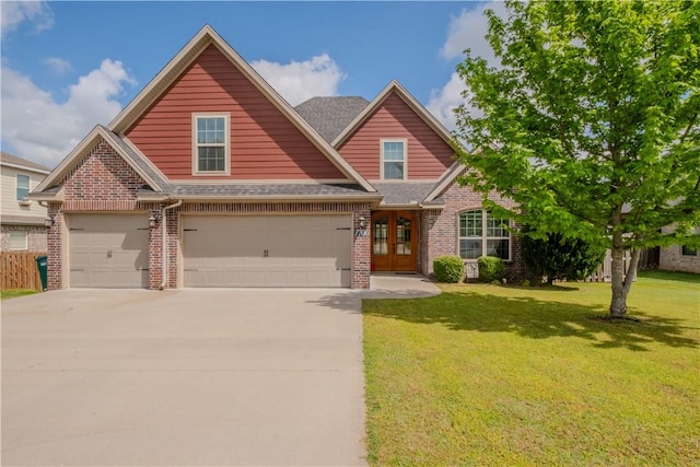 craftsman-style house with a front lawn, french doors, brick siding, a shingled roof, and concrete driveway