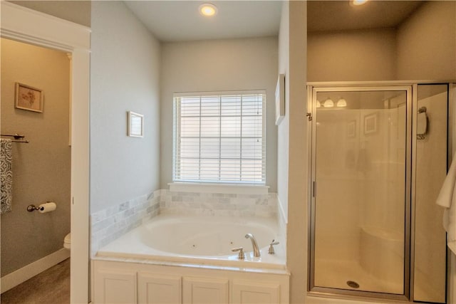 full bath featuring a jetted tub, recessed lighting, a stall shower, and toilet
