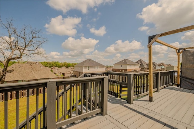 wooden terrace featuring a residential view