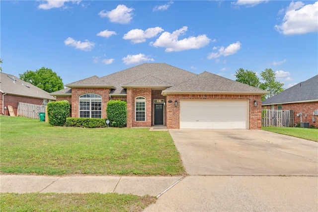 1110 Shiraz Dr, Centerton, AR 72719 - ranch-style home with fence, concrete driveway, a front yard, and a garage