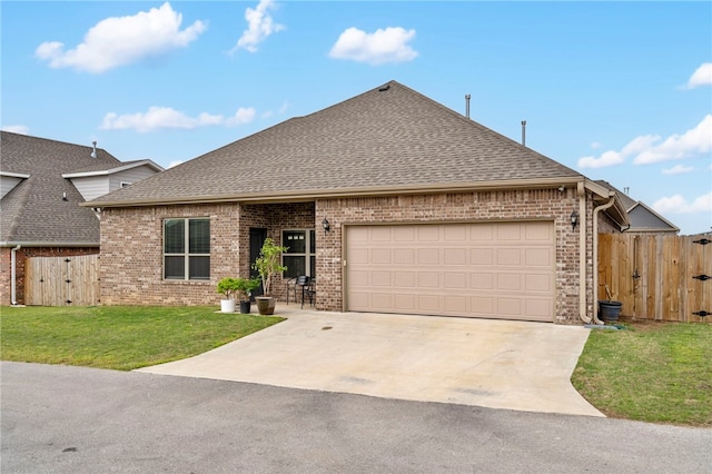 4311 SW Pawhuska St, Bentonville, AR 72713 - ranch-style house featuring brick siding, a gate, an attached garage, and concrete driveway