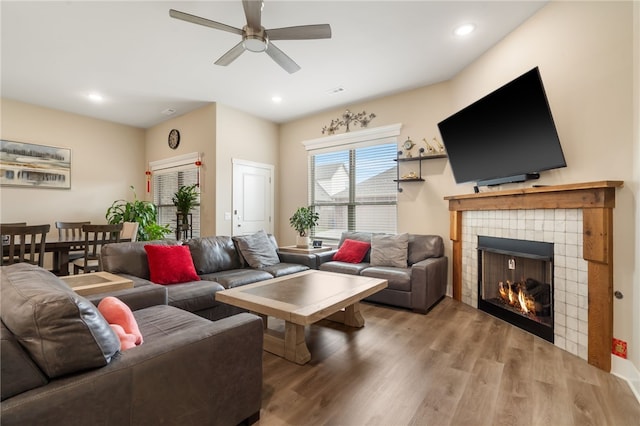 4311 SW Pawhuska St, Bentonville, AR 72713 - living area featuring ceiling fan, a fireplace, recessed lighting, and wood finished floors