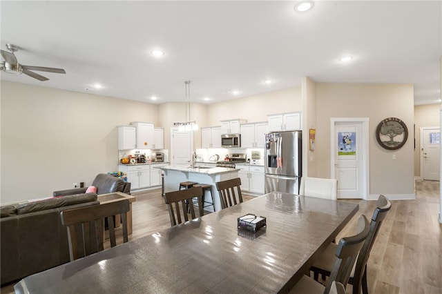 4311 SW Pawhuska St, Bentonville, AR 72713 - dining room featuring recessed lighting, light wood-style flooring, and ceiling fan