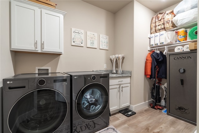 4311 SW Pawhuska St, Bentonville, AR 72713 - clothes washing area with light wood-style floors, baseboards, cabinet space, and washing machine and clothes dryer