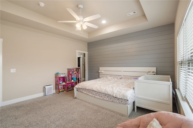 4311 SW Pawhuska St, Bentonville, AR 72713 - bedroom with wood walls, ceiling fan, recessed lighting, a raised ceiling, and carpet