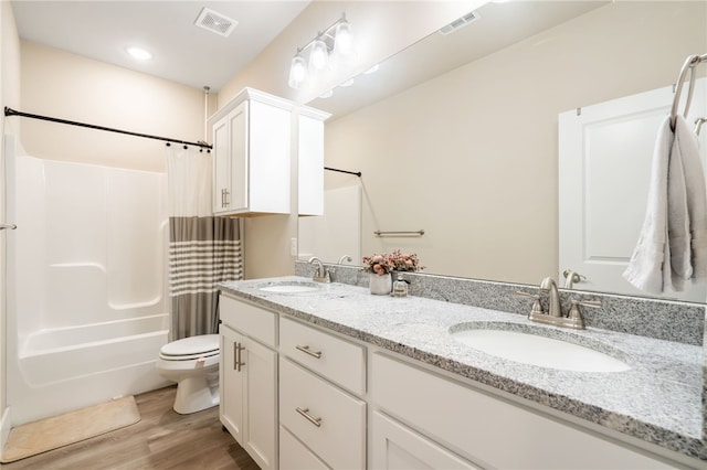 4311 SW Pawhuska St, Bentonville, AR 72713 - full bath with visible vents, a sink, wood finished floors, and toilet