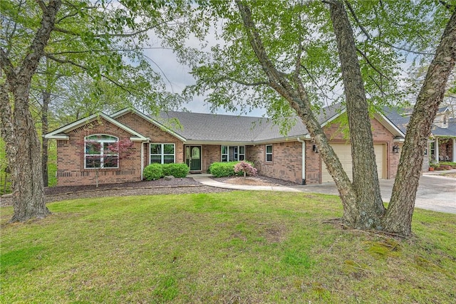 ranch-style home with an attached garage, a front yard, brick siding, and concrete driveway