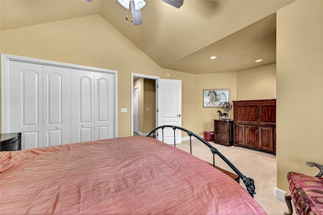 bedroom featuring a closet, carpet flooring, ceiling fan, and vaulted ceiling