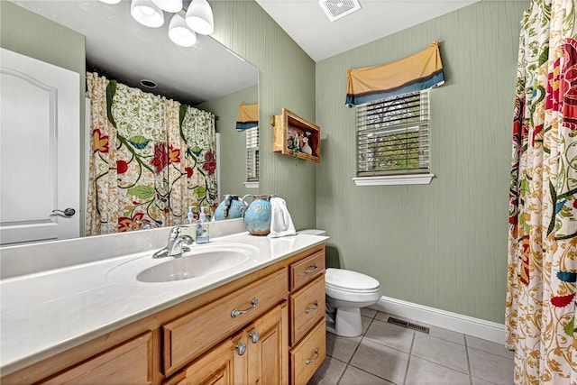 bathroom featuring visible vents, tile patterned floors, baseboards, vanity, and toilet