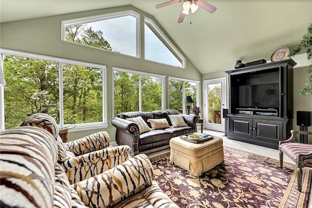 living area with ceiling fan, light carpet, and high vaulted ceiling