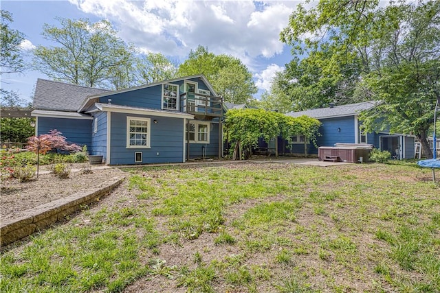 302 4th Ave, Gravette, AR 72736 - back of property with a hot tub