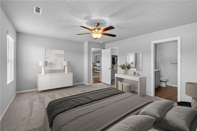 988 E Bunting St, Fayetteville, AR 72701 - bedroom with visible vents, a closet, baseboards, ceiling fan, and carpet flooring