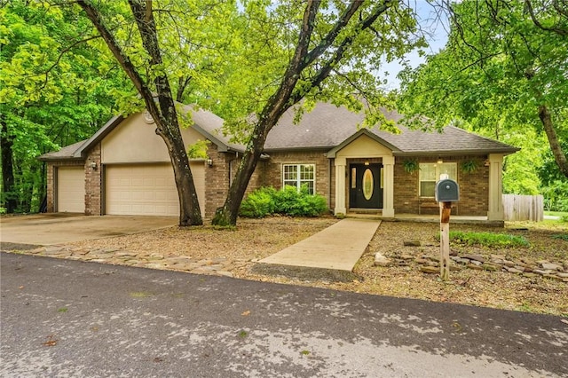2 Saxilby Ln, Bella Vista, AR 72715 - ranch-style home featuring brick siding, driveway, a shingled roof, and a garage