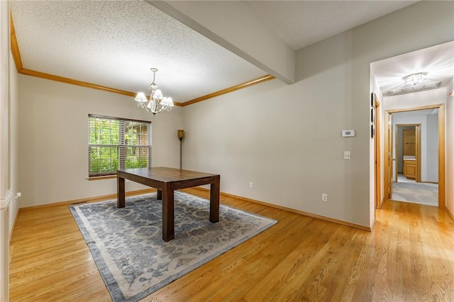 2 Saxilby Ln, Bella Vista, AR 72715 - unfurnished dining area featuring light wood-style floors, a textured ceiling, crown molding, and an inviting chandelier