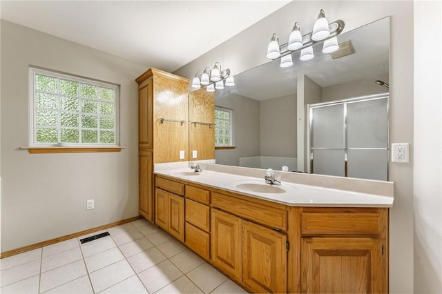 2 Saxilby Ln, Bella Vista, AR 72715 - bathroom with double vanity, visible vents, a shower stall, a sink, and baseboards