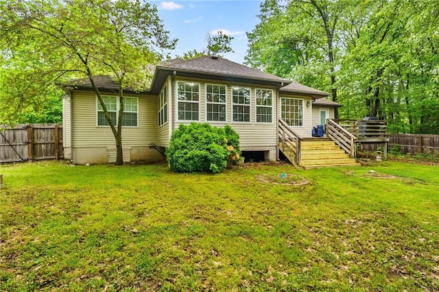 2 Saxilby Ln, Bella Vista, AR 72715 - rear view of property with a lawn, a deck, a shingled roof, and a fenced backyard