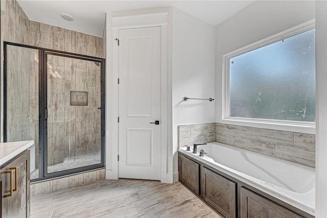 4 Lothian Dr, Bella Vista, AR 72715 - full bath with a garden tub, a stall shower, and vanity