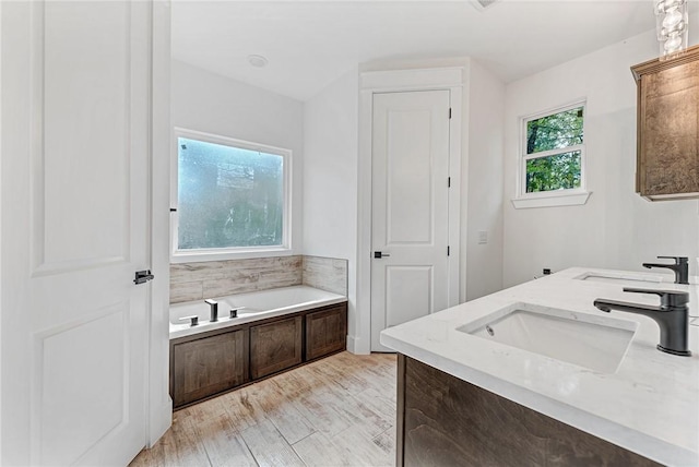 4 Lothian Dr, Bella Vista, AR 72715 - bathroom featuring a garden tub and double vanity