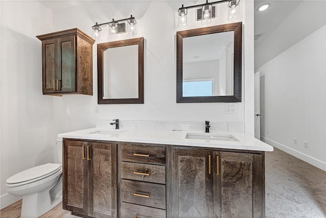 4 Lothian Dr, Bella Vista, AR 72715 - full bathroom with double vanity, toilet, and baseboards