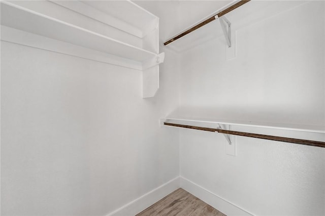 4 Lothian Dr, Bella Vista, AR 72715 - walk in closet featuring light wood-style flooring