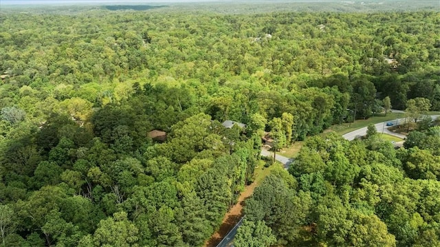 aerial view featuring a wooded view