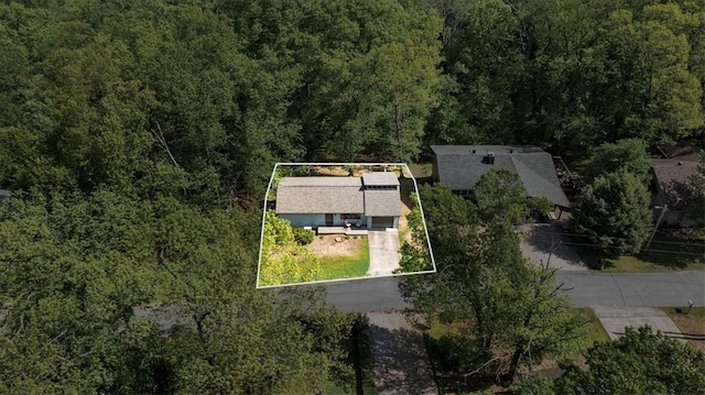 drone / aerial view with a view of trees