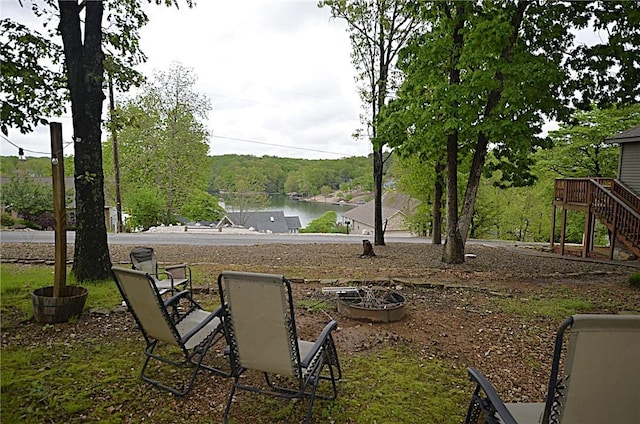 3 Evelynia Cir, Bella Vista, AR 72715 - view of yard with stairs and a deck with water view