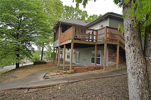 3 Evelynia Cir, Bella Vista, AR 72715 - back of property with a patio area and a wooden deck