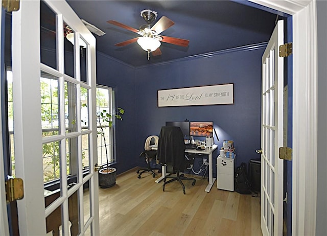 home office featuring a ceiling fan, french doors, and wood finished floors